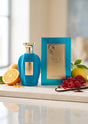 Flacon et coffret PDS SHOP Voux Turquoise Emir entourés d'agrumes, de fruits rouges et de gousses de vanille.